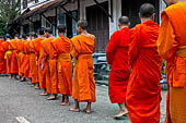 Luang Prabang, Laos - At dawn, monks receive their alms, the 'Tak bat'.